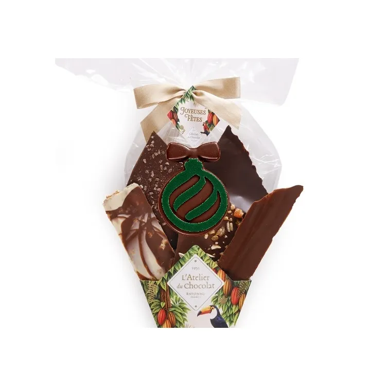 Focus bouquet de Chocolat® et sa bouchée boule verte de Noël Assortiment de fines feuilles de chocolat 255g