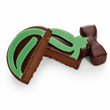 Bouchée boule verte de Noël praliné chocolat au lait découpe